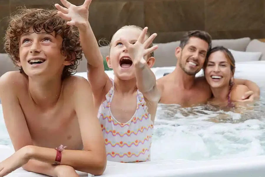 6 people hot tub with ambient lighting and bubbling water in backyard